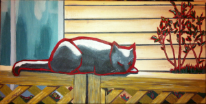 Cat snoozing on a fence